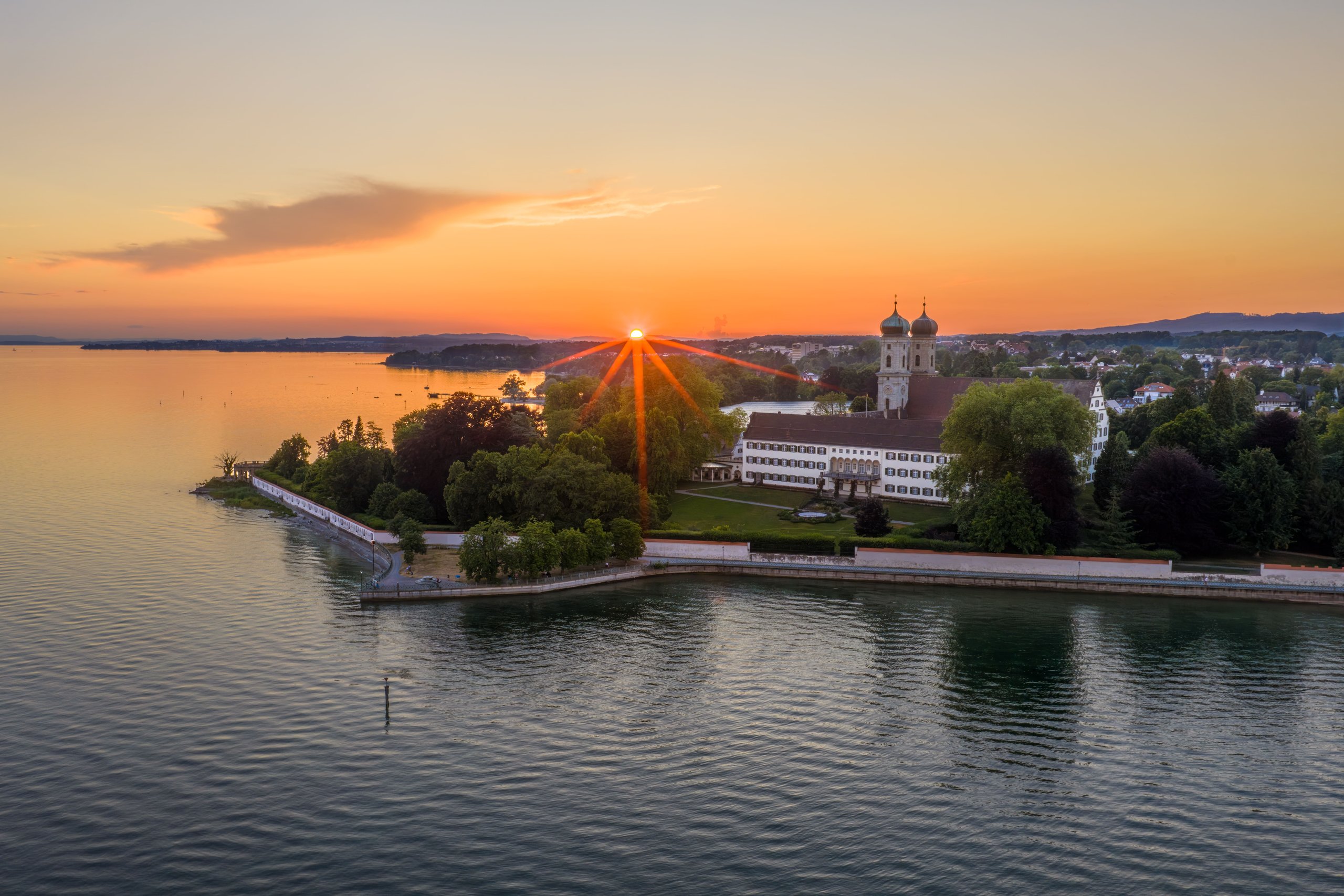 Friedrichshafen Palace Church on Lake Constance at sunset, seen from the air