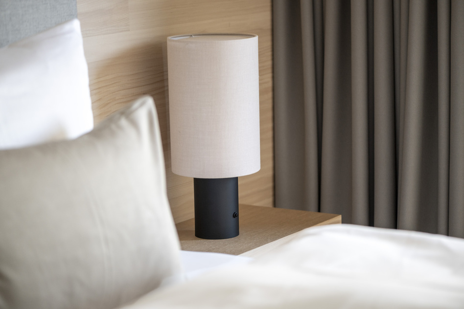 Bedside table detail in a hotel room at Seegut Zeppelin